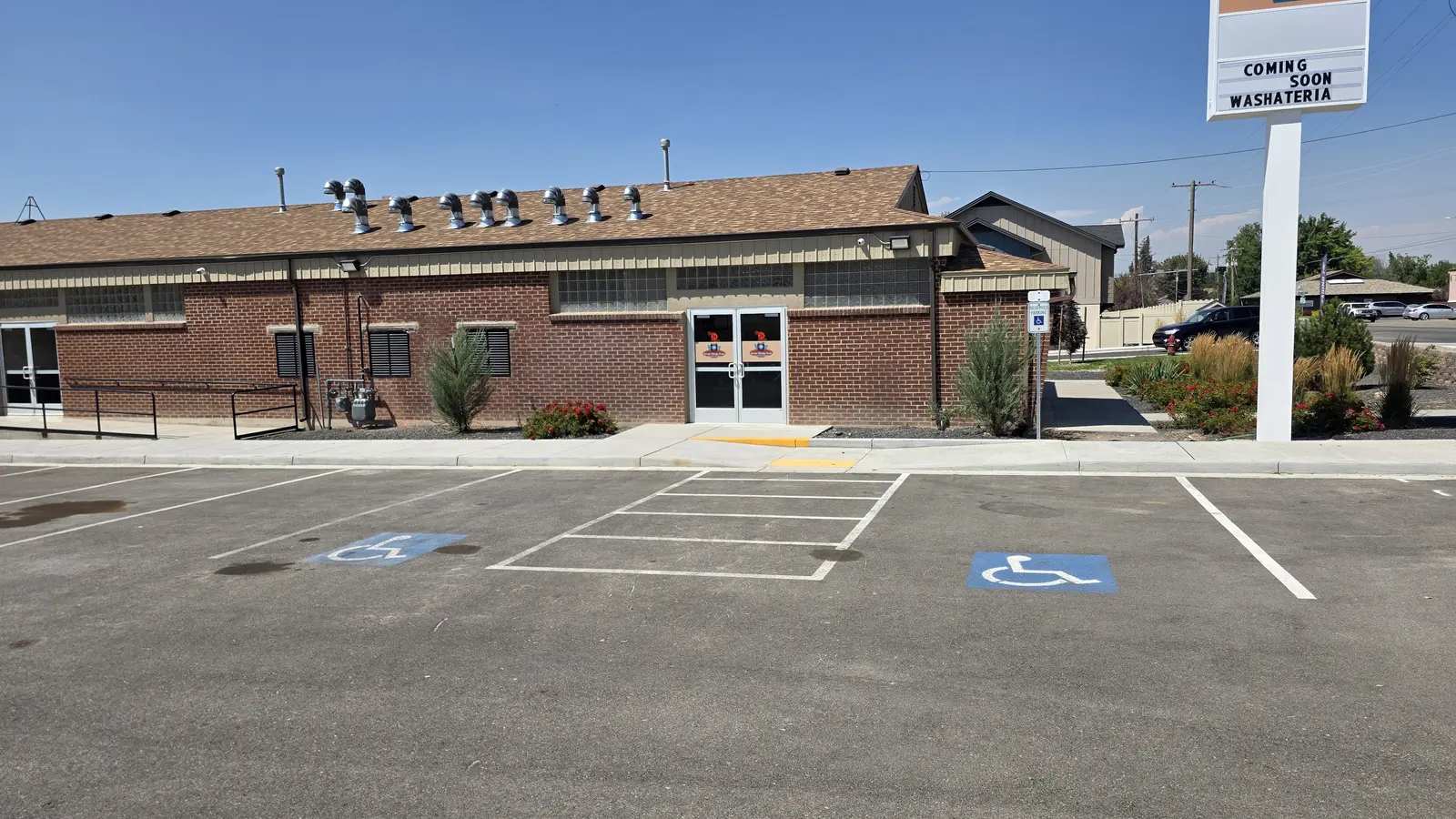Striped accessible parking spaces directly in front of the Jerome Handy Wash entrance